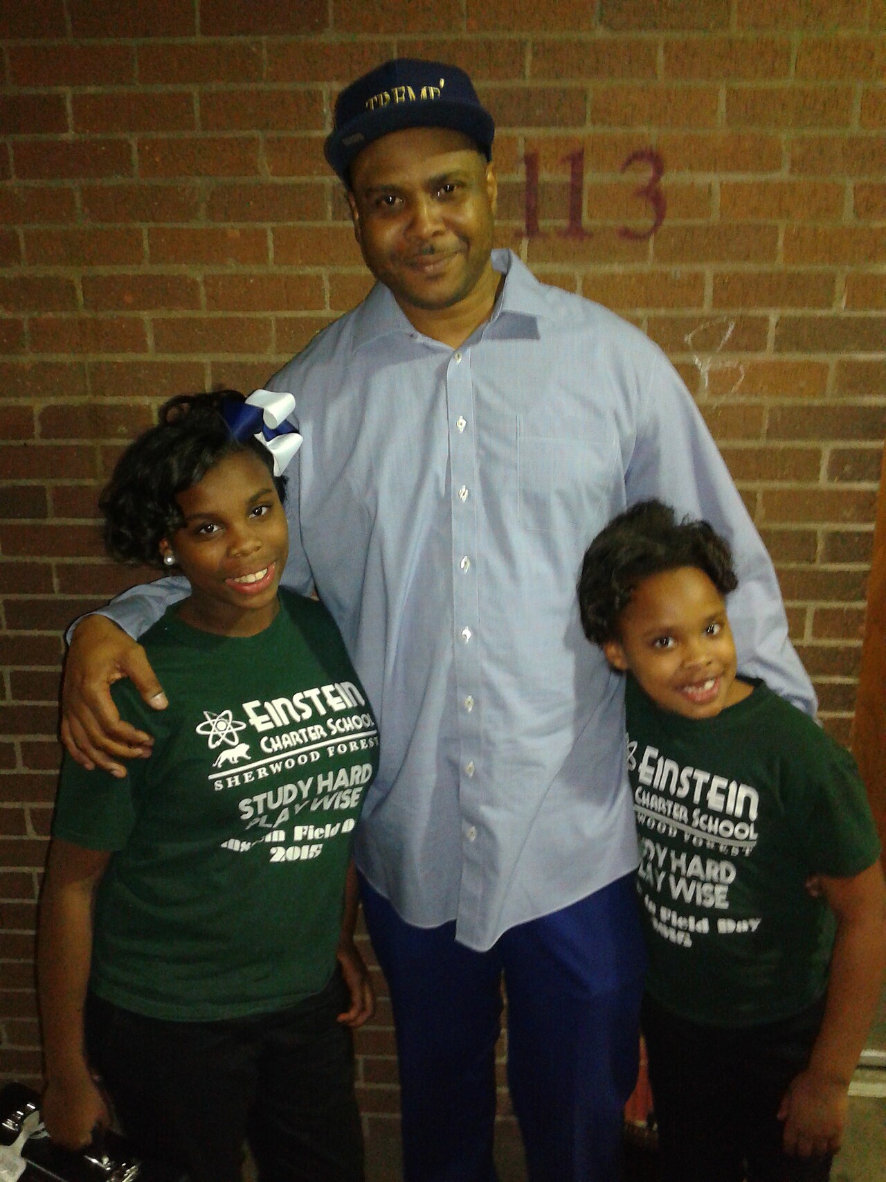 Roots of Music co-founder and Rebirth Brass Band snare drummer, Derrick Tabb, with two Roots of Music students 12/8/2015