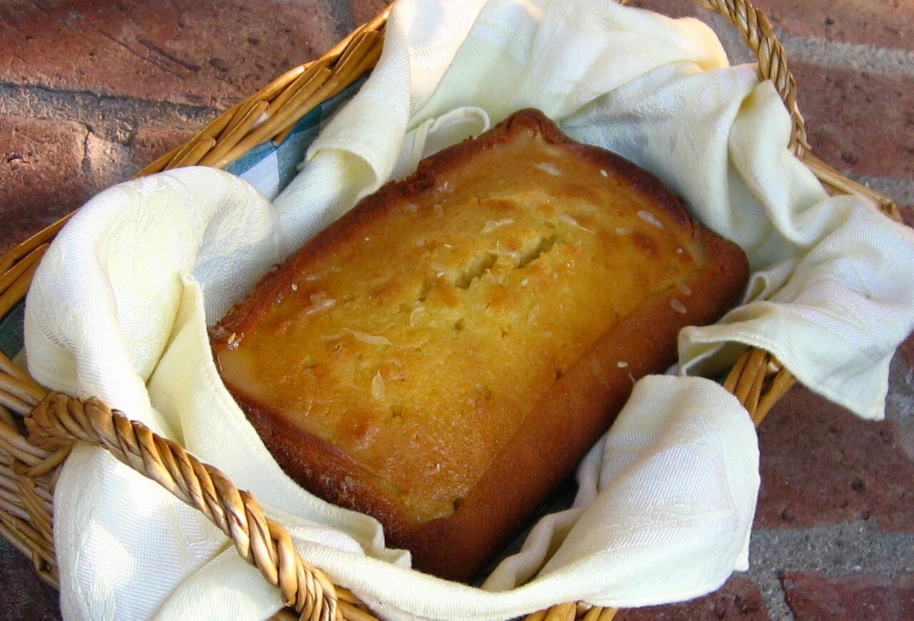 Glazed lemon pound cake in basket.