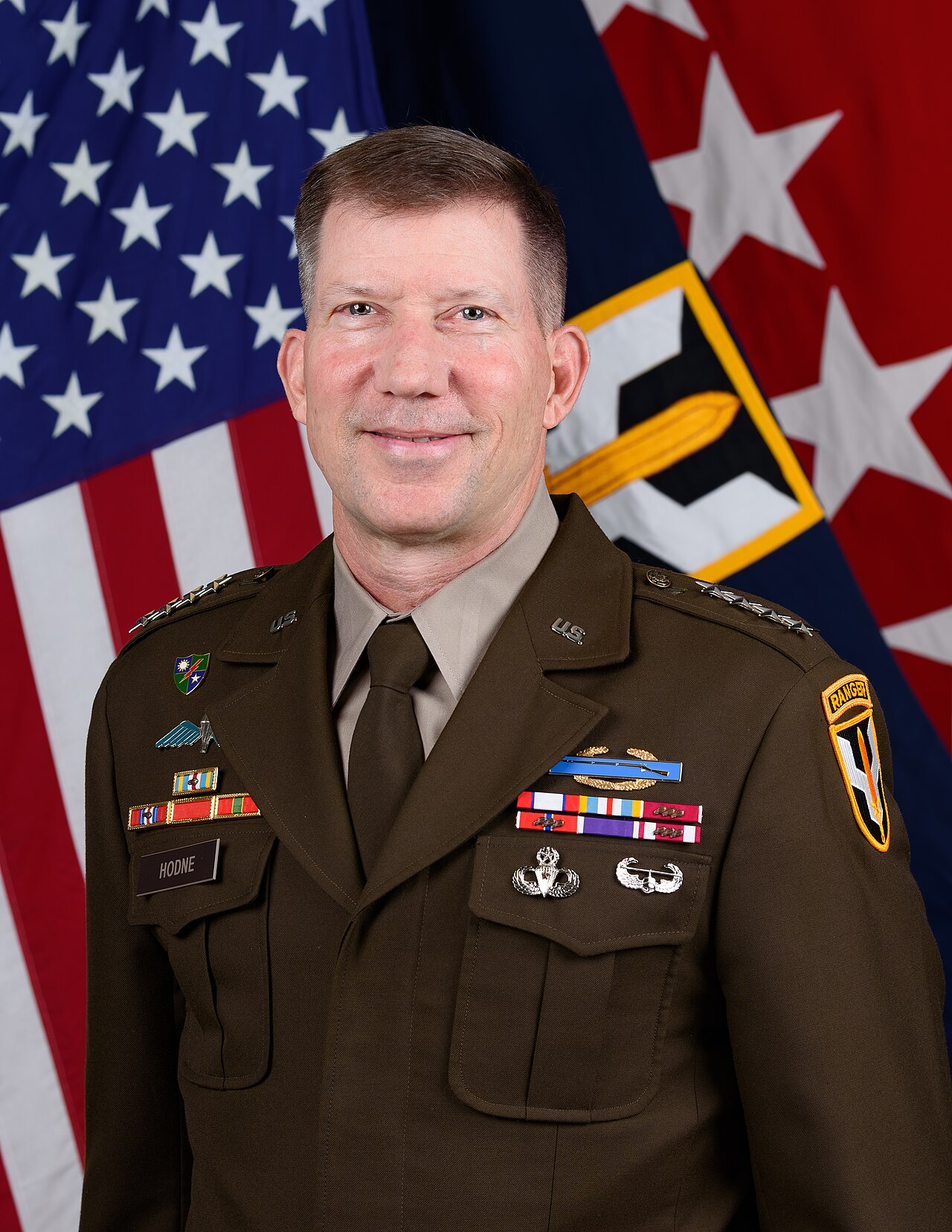 General David M. Hodne, Commanding General, United States Transformation and Training Command, poses for a command portrait at the Enterprise Multimedia Center Fort Eustis, VA.