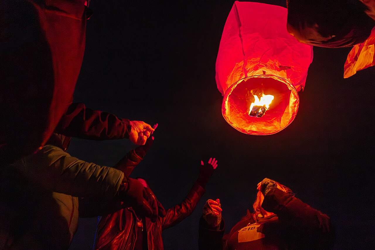 Participants in a vigil for Renee Good launch a sky lantern on January 9, 2026 from Lake Bemidji in Bemidji, Minnesota - 55043044565


Photograph by Lorie Shaull.