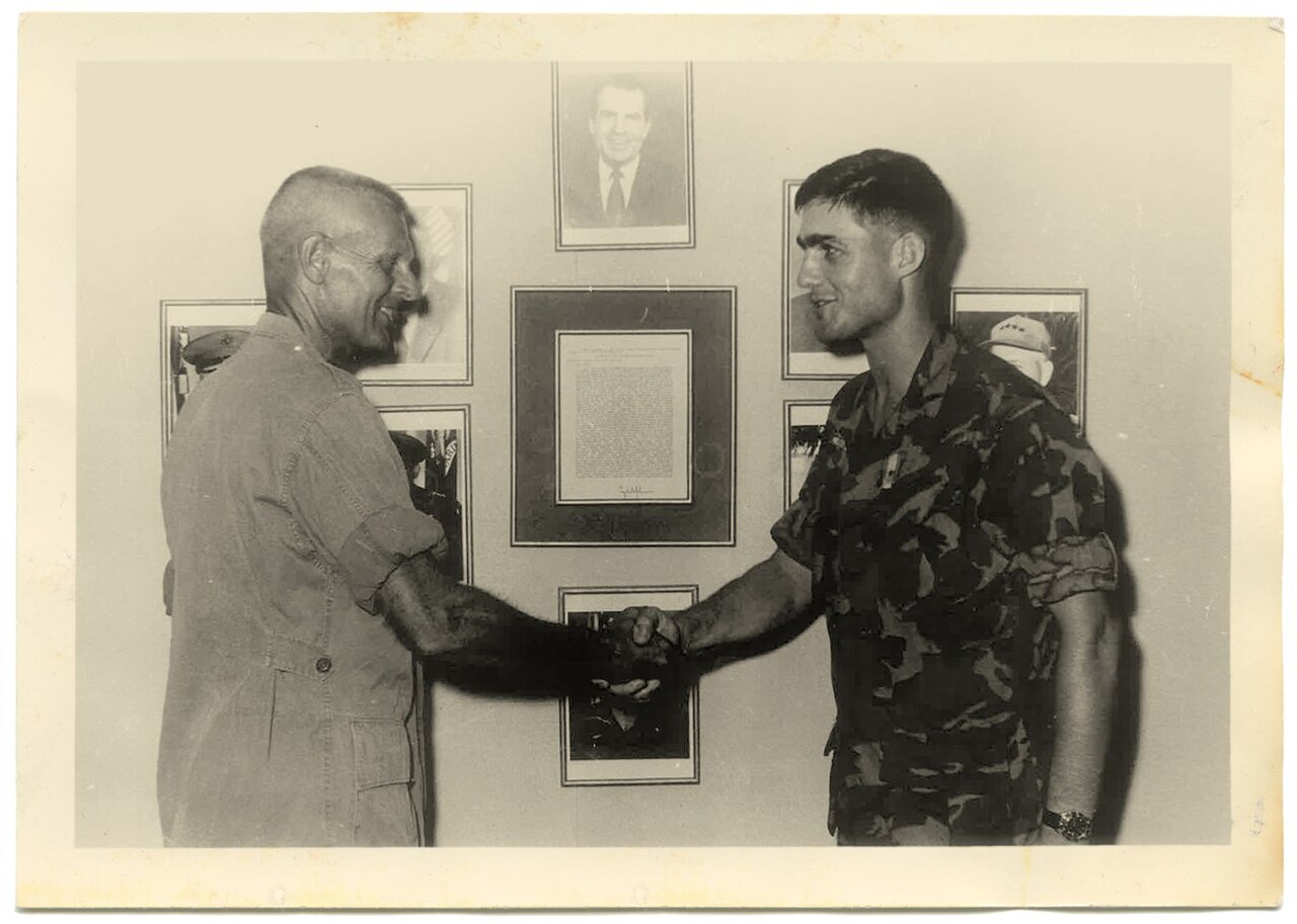 Robert Mueller receives an award from his regimental commander Col. Martin “Stormy” Sexton in Dong Ha, South Vietnam in 1969.