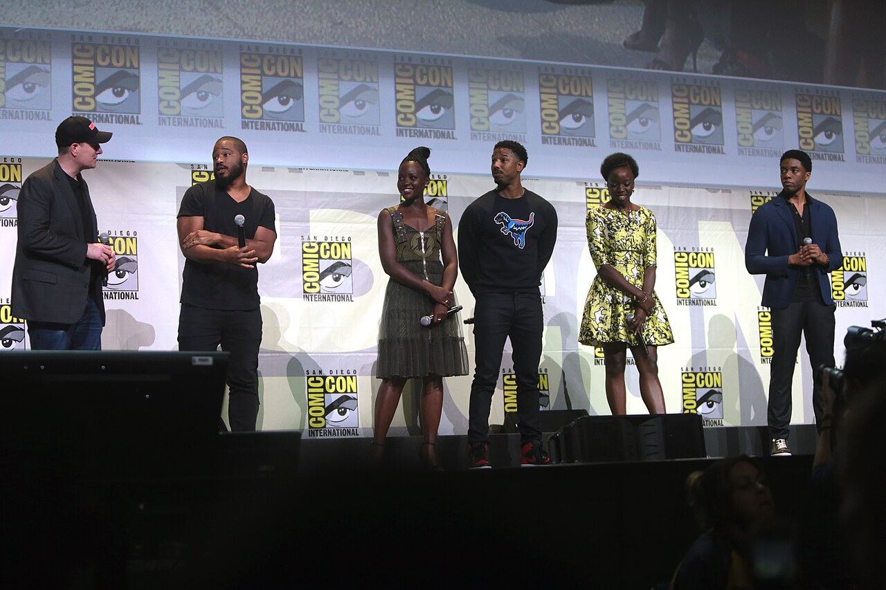 Kevin Feige, Ryan Coogler, Lupita Nyong'o, Michael B. Jordan, Danai Gurira and Chadwick Boseman speaking at the 2016 San Diego Comic Con International, for "Black Panther", at the San Diego Convention
